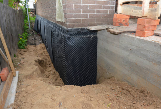 SJ Waterproofing Pros technician performing targeted Vapor Barrier Installation assessment in Dalton, WI